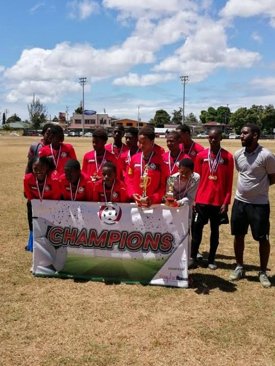 Champions of the Concept Coaching Under-14 Youth Cup, FC Ginga, following their 5-1 win over Hearts of Maloney in the final at Constantine Park, Macoya, Saturday.