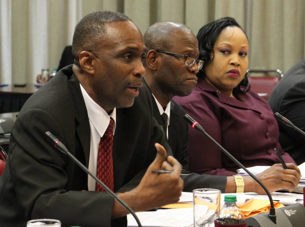 (Left) DCP Harold Phillip of Crime and Support, Senior Superintendent John Frederick of Court and Process and Assistant Superintendent Claire Guy-Alleyne of Children Protection Unit
 during the Special Select Committee of Senate on Sexual Offences Amendment Bill. PHOTO BY ROGER JACOB.  