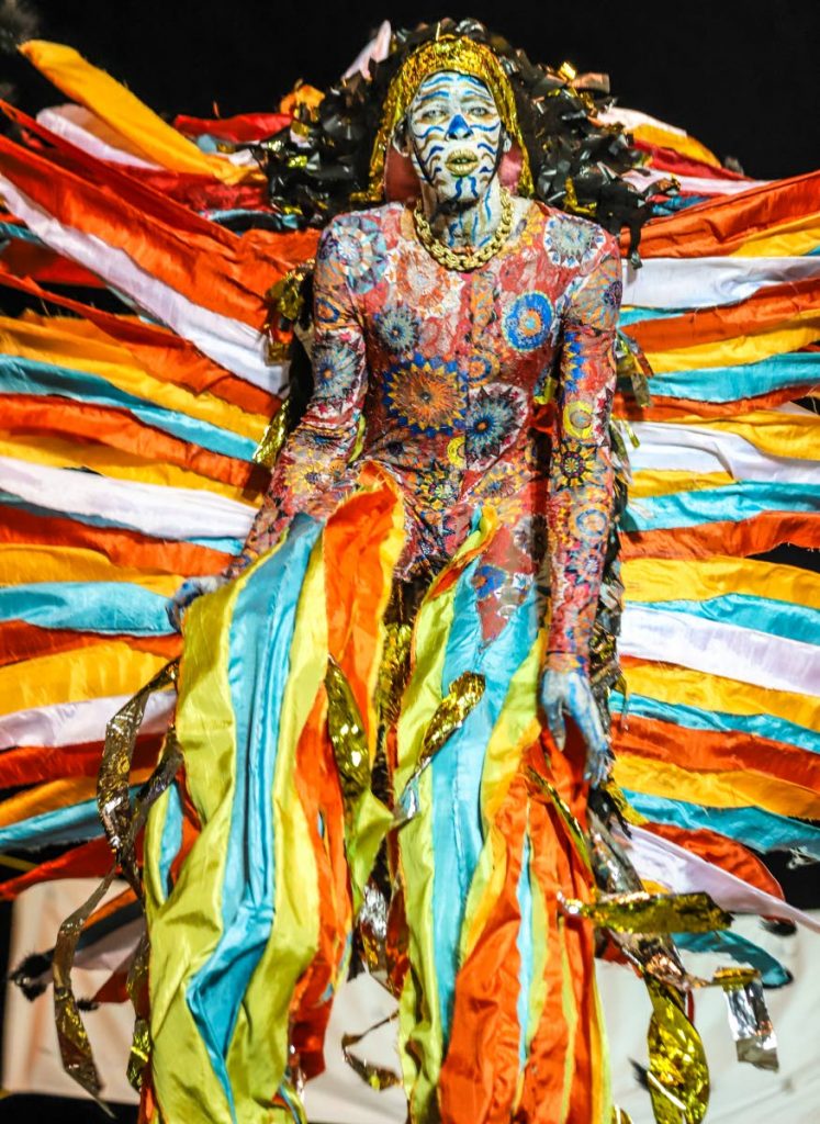 In this file photo A Blazing Moko portrayed by Tekel Sylvan stands tall at the National Carnival Commission’s Traditional Carnival individual competition at Adam Smith Square, Woodbrook. - PHOTO BY JEFF MAYERS