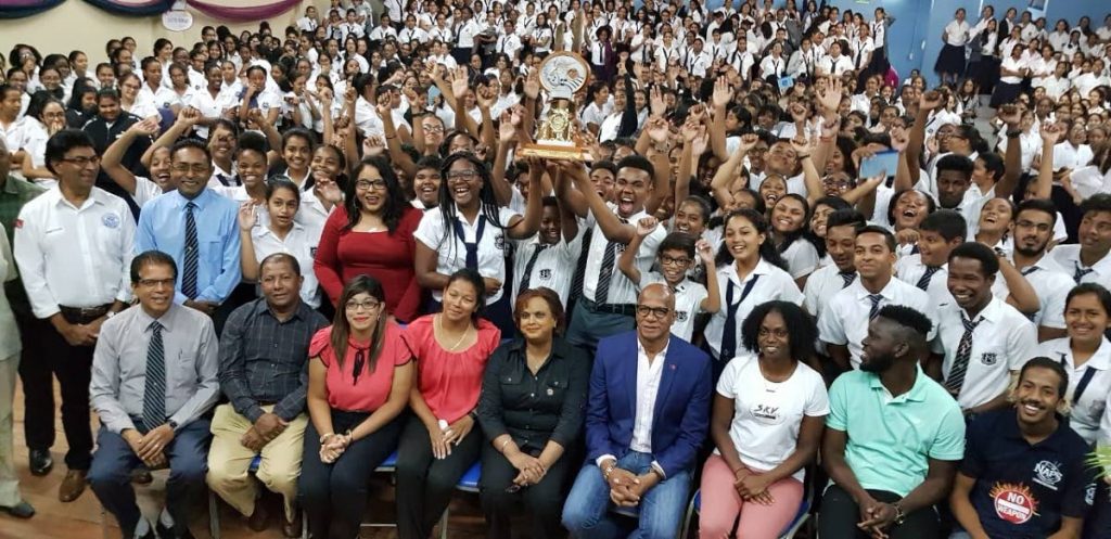 San Fernando Mayor Junia Regrello, centre, and, to his right, Naparima Girls principal Carolyn Bally Gosine with members and supporters of the Naparima Combined Steel Orchestra, celebrate the bands Junior Panorama victory on Tuesday.  Seated at the far right is Naparima Boys pricipal Dr Michael Dowlat. PHOTO BY YVONNE WEBB
