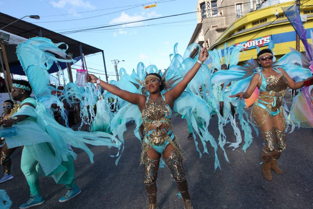 A Lost Tribe reveller celebrates the mas downtown Port of Spain in Carnival 2018. FILE PHOTO