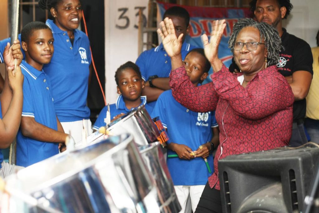 Pan Trinbago president Beverly Ramsey-Moore with young players of Edinburgh 500 steel ensemble during the qualifying round of single pan judging on January 23. FILE PHOTO