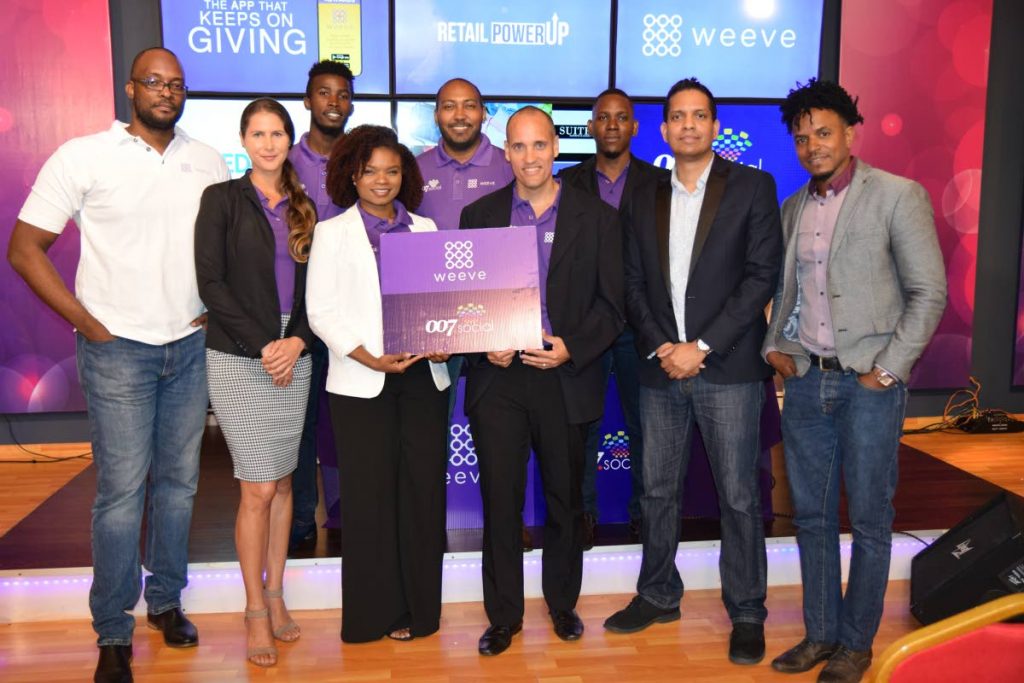 Khari Goddard (front row, from left), solutions engineer, Weeve; Gabrielle Duval, Weeve sales manager; Chrystal Martin, social strategist at 007.Social; Weeve founder Richard Marshall; Kirwin Narine, founder of 007.Social; and Dual Point System founder Marlon Grant. Standing in the back are Shaquille John, Weeve sales agent; Clint Cielto, marketing and business development; Justin Scipio, Weeve's chief performance officer; and Gabrielle Duval, client relations, Weeve.