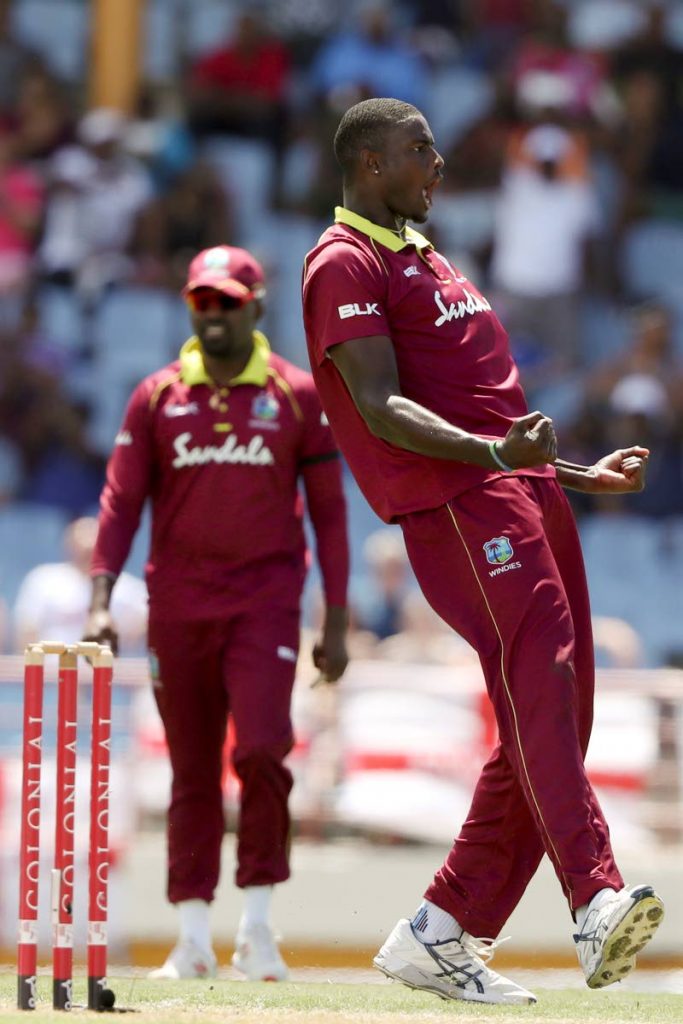 West Indies' captain Jason Holder celebrates taking the wicket of England's Adil Rashid during the fifth One Day International cricket match at the Daren Sammy Cricket Ground in Gros Islet, St. Lucia, yesterday. (AP Photo)