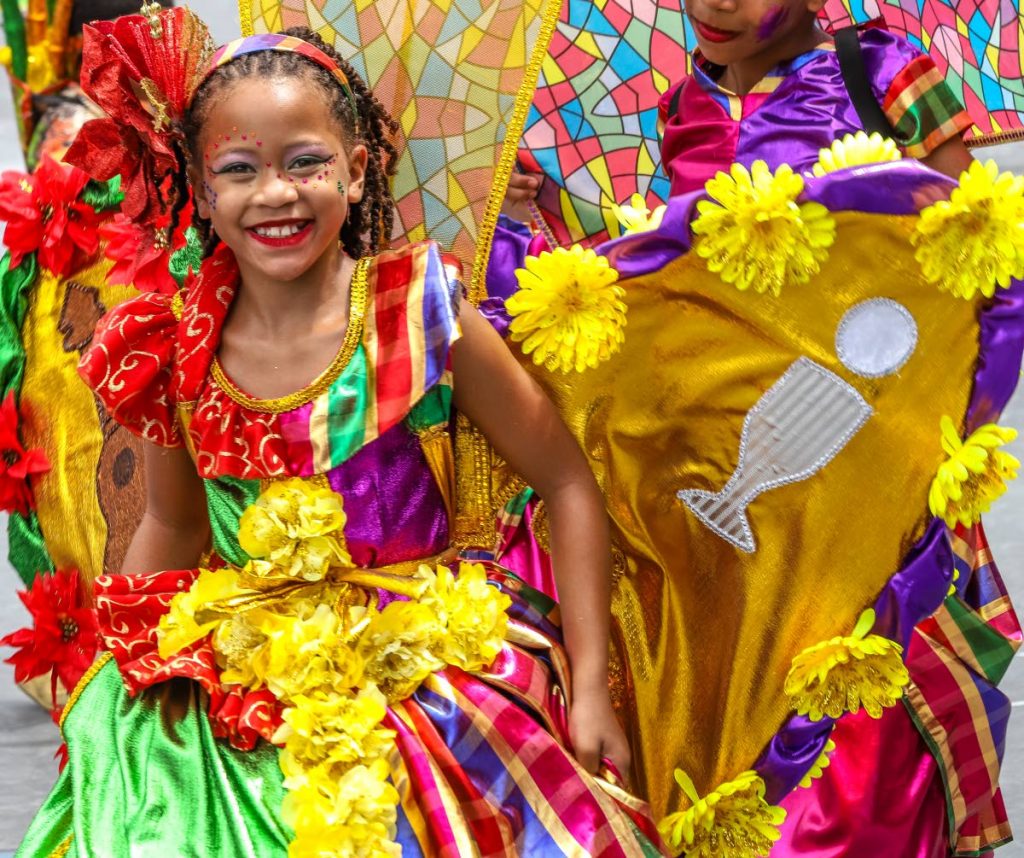 Carnival joy: A Paramin RC School masquerader's smile and vibrant costume truly reflects their presentation De Spirit of Carnival at the Republic Bank Junior Parade of the Bands, Queen's Park Savannah, Port of Spain yesterday. See page 5. PHOTO BY JEFF MAYERS
