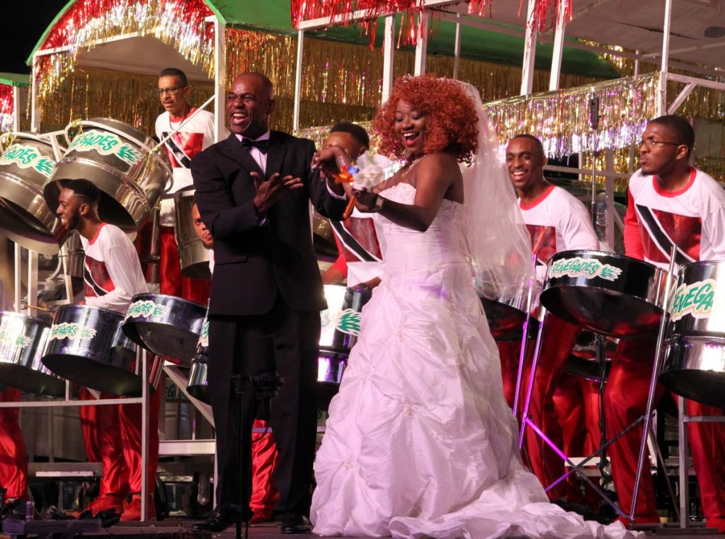 2019 Champion Renegades arranger Duvone Stewart brings his “bride” on stage as the band performs Farmer Nappy’s Hookin Meh on its way to its 11th Panorama title on Saturday night at the Queen’s Park Savannah in Port of Spain. PHOTO BY ROGER JACOB