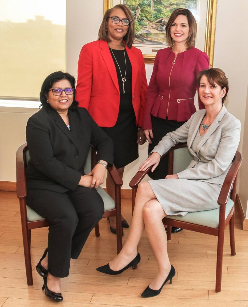 BPTT's top executives: Seated are Camille Boodhai-Kangal, regional director, procurement and supply chain management, left, and Claire Fitzpatrick, regional president. Standing are Wendy Fae Thompson, managing counsel, left, and Giselle Thompson, vice president, corporate operations. PHOTOS BY AYANNA KINSALE