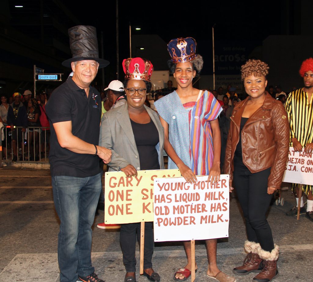 Culture Minister Dr Nyan Gadsby-Dolly, right and Port of Spain Mayor Joel Martinez , left with the  Queen of J'ouvert Lynelle Pierre 2nd from left and J'ouvert King Ronel Pierre .pHOTO SUREASH CHOLAI