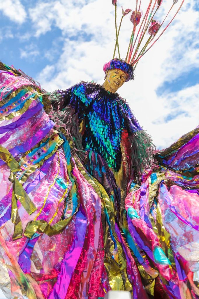 A moko jumbie from Moko Somokow had to contend with strong winds yesterday at the Queen’s Park Savannah.