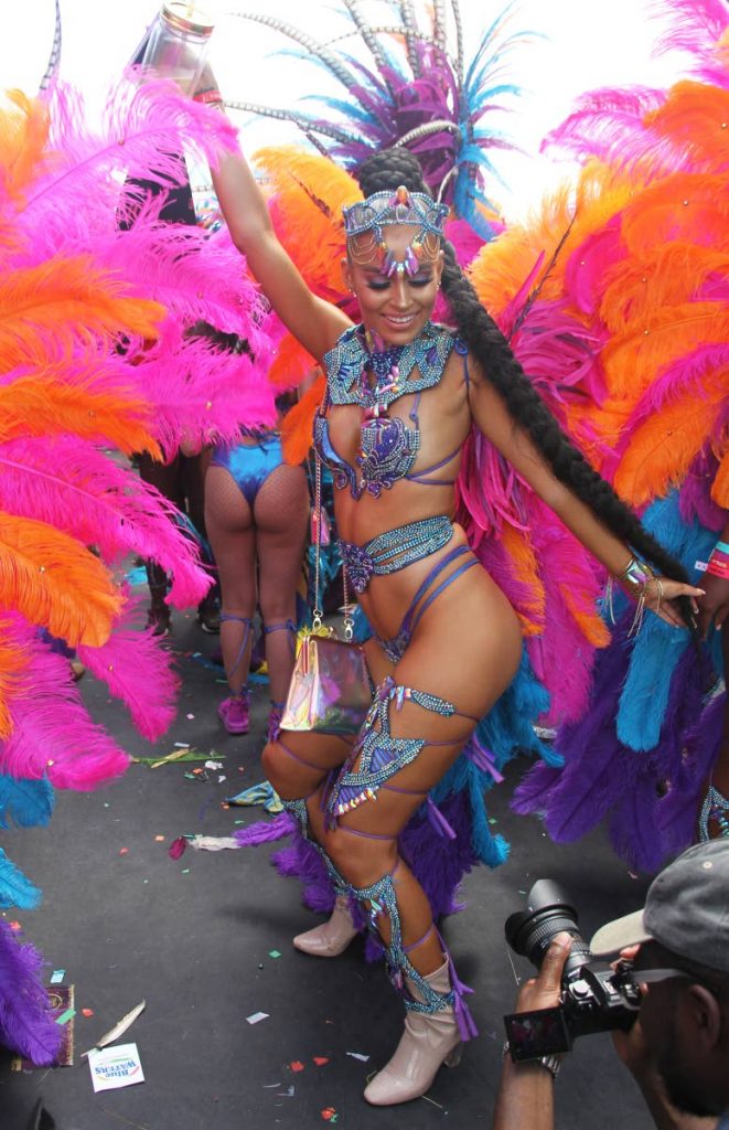 A Tribe masquerader savors the revellery at Socadrome, Jean Pierre Complex, Port of Spain on Carnival Tuesday. PHOTO BY AYANNA KINSALE