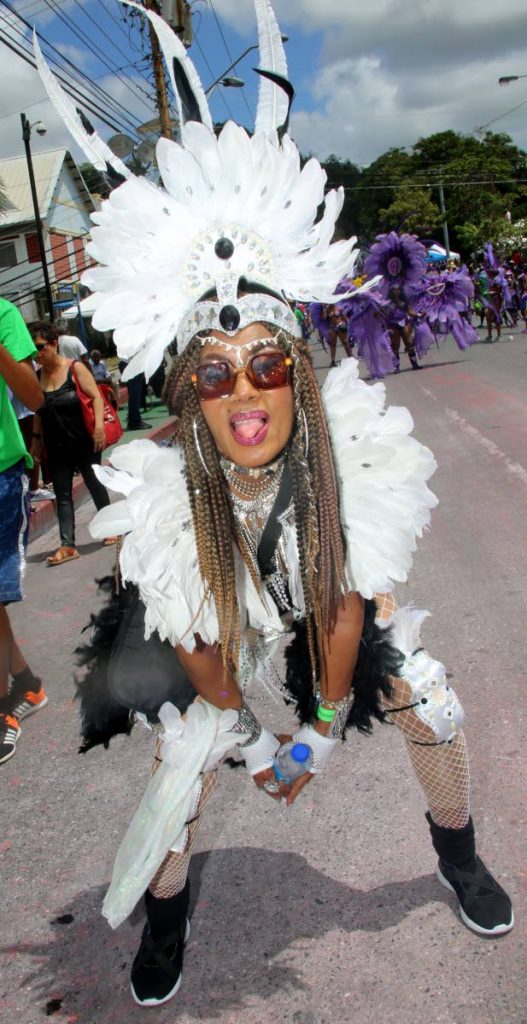 SHE’S A TEASE: A masquerader from the band Fireworks and Associates teases while she plays her mas on Carnival Tuesday in San Fernando. The band was yesterday declared San Fernando Carnival Band of the Year.