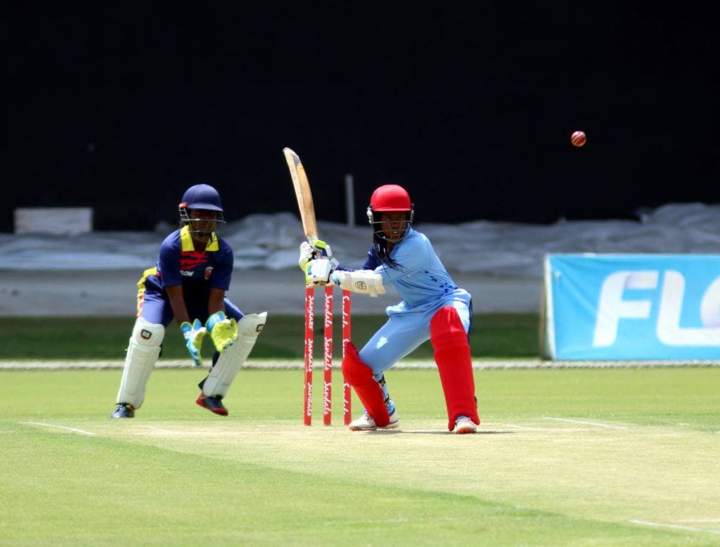 A South Zone batswoman keeps her eyes locked on the ball before attempting to play a shot against the South-East Zone, yesterday, at the Brian Lara Cricket Academy, Tarouba.