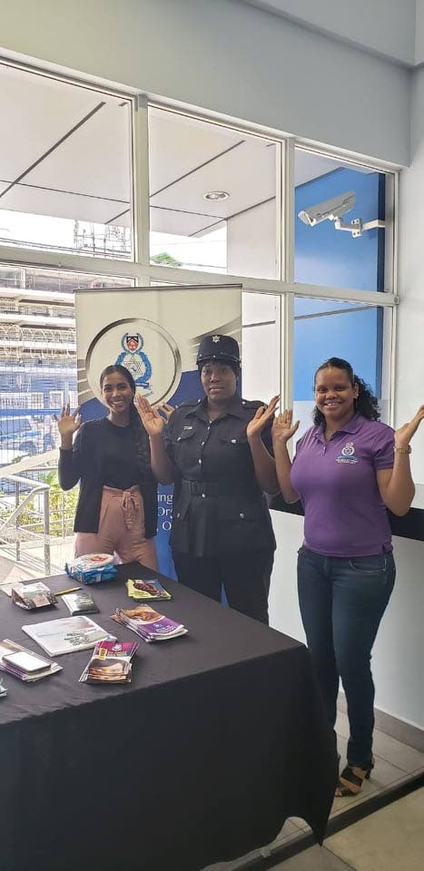WPC Yearwood, centre, of the Besson Street Police Station poses with Susie Beharry and Samantha Griffith of the Police Service Victim and Witness Support Unit during a public education drive at the station this morning.   PHOTO COURTESY THE TTPS