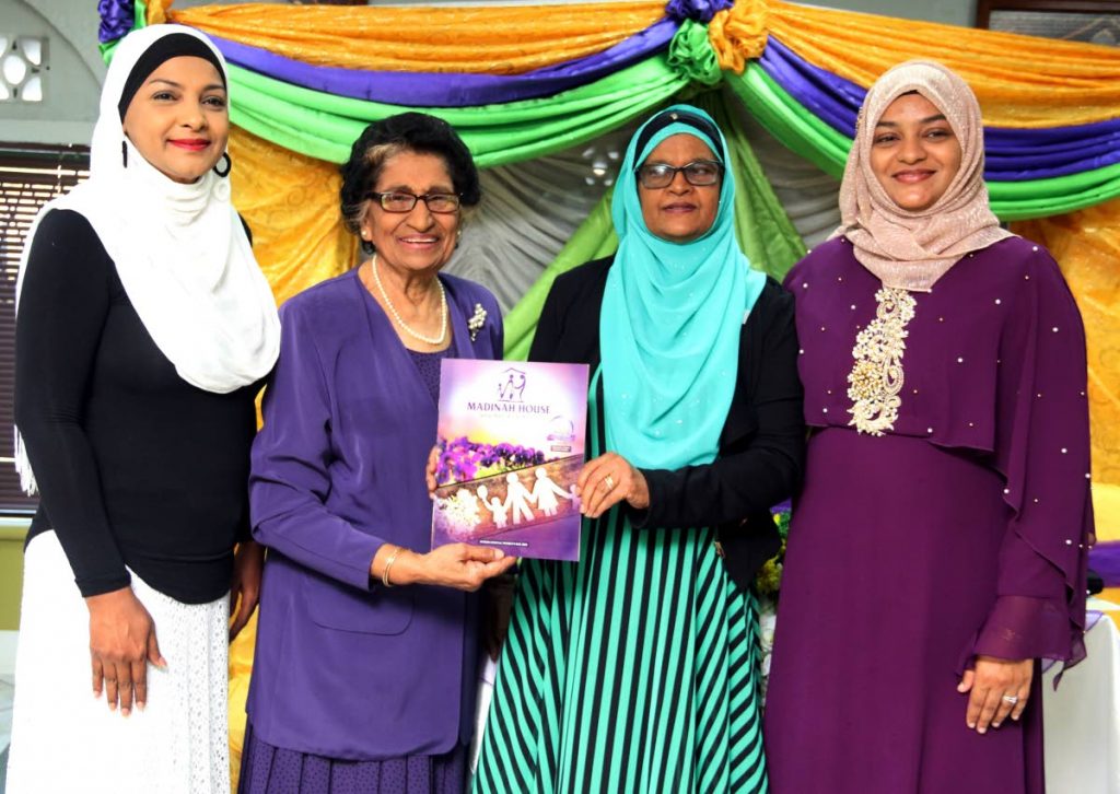 Assistant resident representative of the UNDP (TT) Sharifa Ali-Abdullah, (left to right) Zalayhar Hassanali, Madinah House president Lydia Choate and Sabeerah Maryann Khan share the stage at the launch of a commemorative magazine, which celebrates Madinah House’s 20th anniversary, at the Prince Albert Street Mosque, San Fernando yesterday. PHOTOS BY ANSEL JEBODH