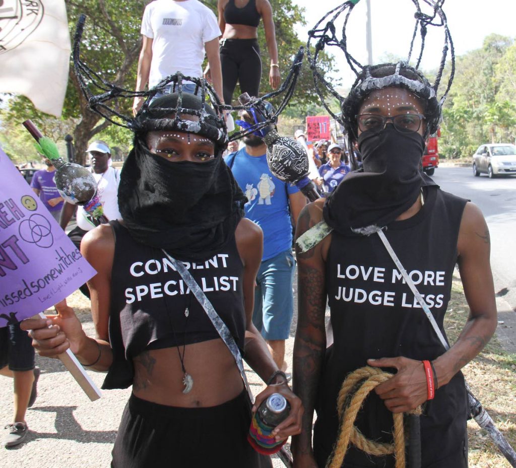 Activists in costume share the message of women's rights during march and rally at Queen's Park Savannah, Port of Spain yesterday, in observance of International Women's Day which was Friday. PHOTO BY ANGELO MARCELLE