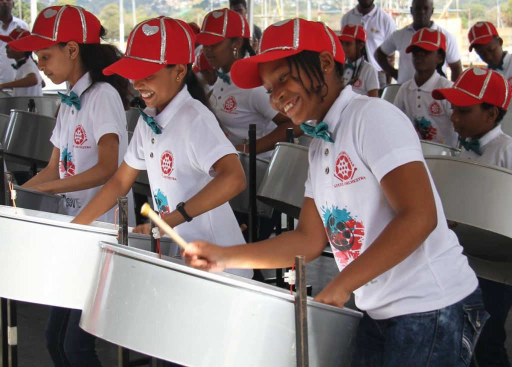 PAN SMILES: Students from Guaico Presbyterian Primary enjoyed themselves yesterday at the Education Ministry's inaugural Schools Champs in Concert show at the Queen's Park Savannah in Port of Spain. PHOTO BY AYANNA KINSALE