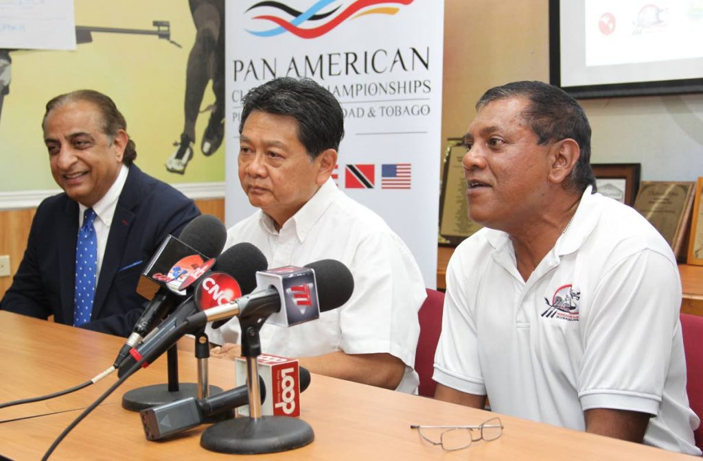 Vinod Bajaj General Manager at Magdalena Grand Hotel ,left, Franco SiuChong president of Pan American Dragon Boat Federation,centre, and Keith Dalip president of the TT Dragon Boat Association speak with the media during the launch,yesterday, of the Pan Am Dragon Boat Club Crew Championships, held at the Olympic House, Abercromby Street, Port of Spain.
