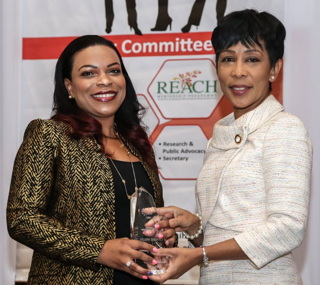 Sharon Rowley (right), wife of Prime Minister De Keith Rowley, presents the Business Pioneer award to Candice Welch, chartered quantity surveyor and director of Welch, Morris and Associates at AFETT Women of Influence Awards and Mentorship function Hyatt Regency, Port of Spain. Photo by Jeff K Mayers