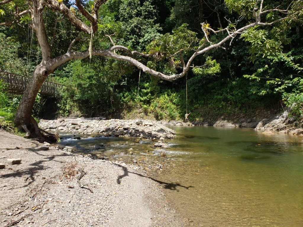 The peaceful waters of Shark River, Matelot, which a community group, St Helena/Matelot Farmers on the Move, claim they have kept clean without help from any state agency. PHOTOS BY ROGER JACOB
