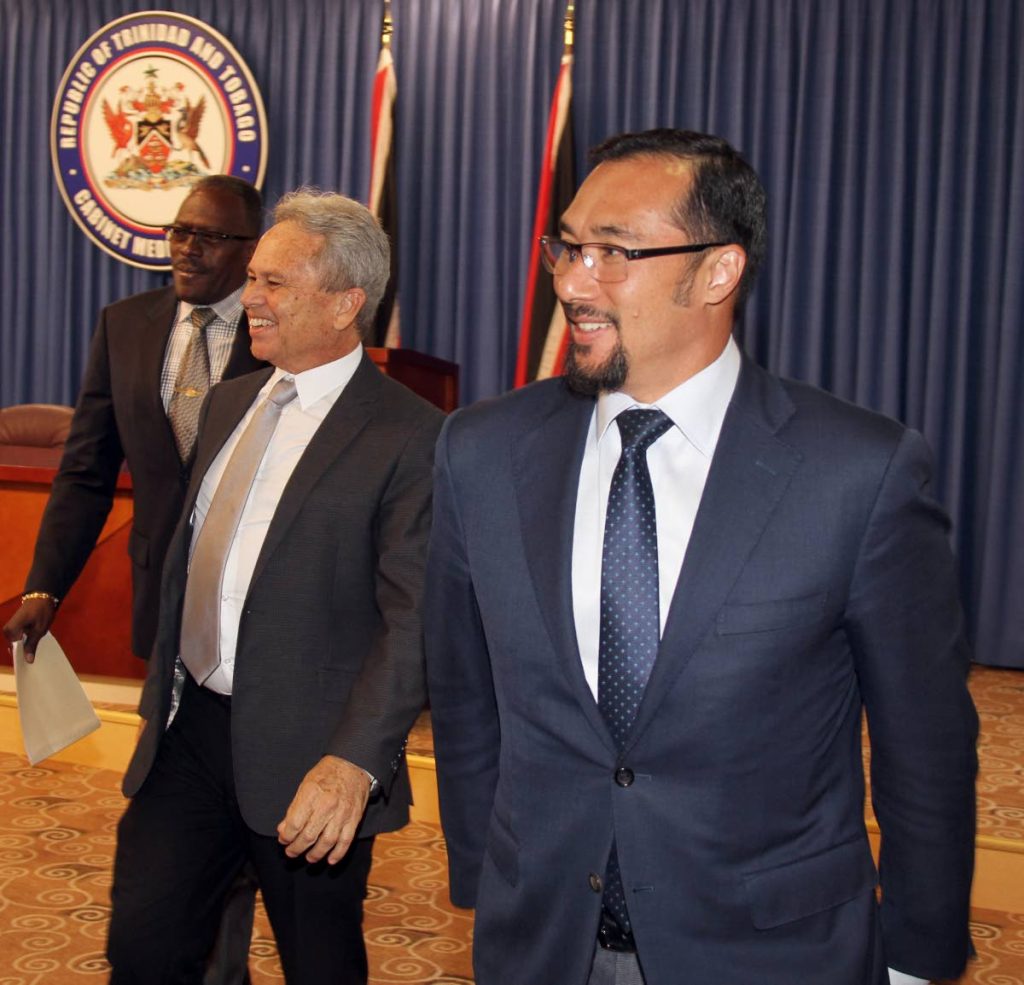 TALK DONE: Acting Prime Minister Colm Imbert, centre, National Security Minister Stuart Young, right, and Housing Minister Edmund Dillon at the end of yesterday's post Cabinet press briefing at the Diplomatic Centre in St Ann's. PHOTO BY SUREASH CHOLAI