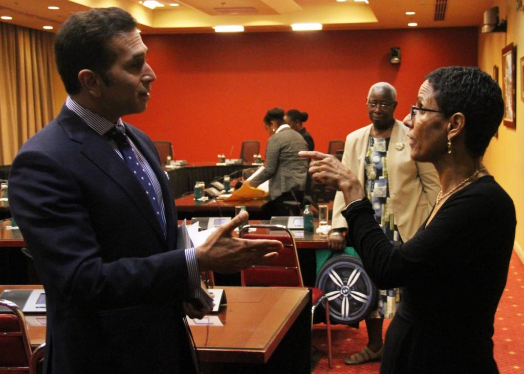 INTENSE TALK: President of the Coalition Against Domestic Violence Roberta Clarke speaks with Attorney General Faris Al Rawi yesterday at a Special Seclect Committee (Senate) hearing on the Sexual Offenders Amendment Bill in Port of Spain. PHOTO BY AYANNA KINSALE