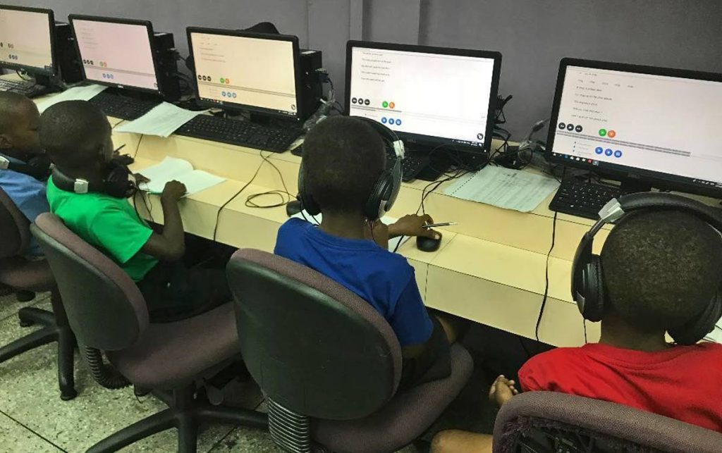 These students of Nelson Street Boys RC have fun while learning through the use of the Arrow learning software.