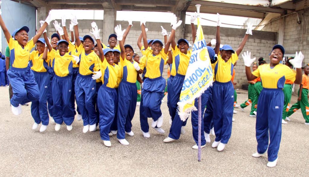 Barataria Anglican students celebrate after winning the march past at the St George East district games at the Larry Gomes Stadium in Arima, yesterday. PHOTO BY AYANNA KINSALE