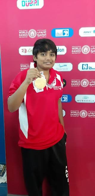 TT's Melissa Nanan displays her gold medal, which she won in the 50m freestyle at the Special Olympics 2019 World Summer Games, in Abu Dhabi, United Arab Emirates, on Saturday. 