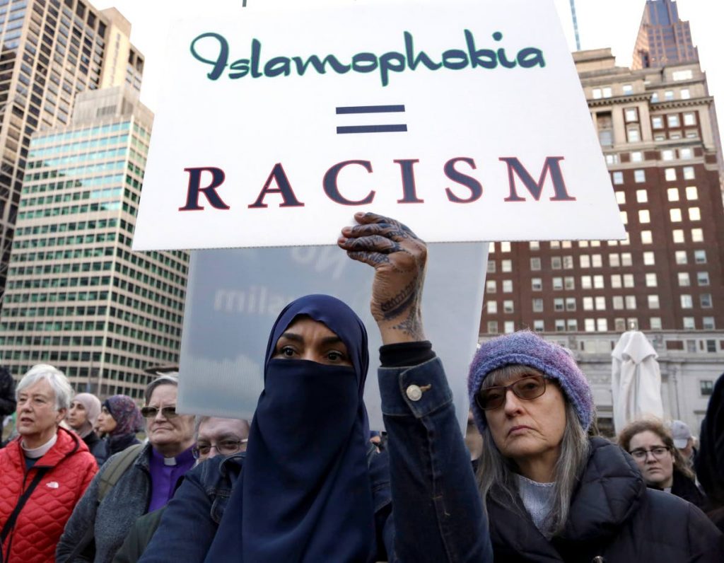 An interfaith gathering is held in Philadelphia yesterday, to mourn the Muslim worshippers killed during a mass shooting
 in Christchurch, New Zealand. AP PHOTO