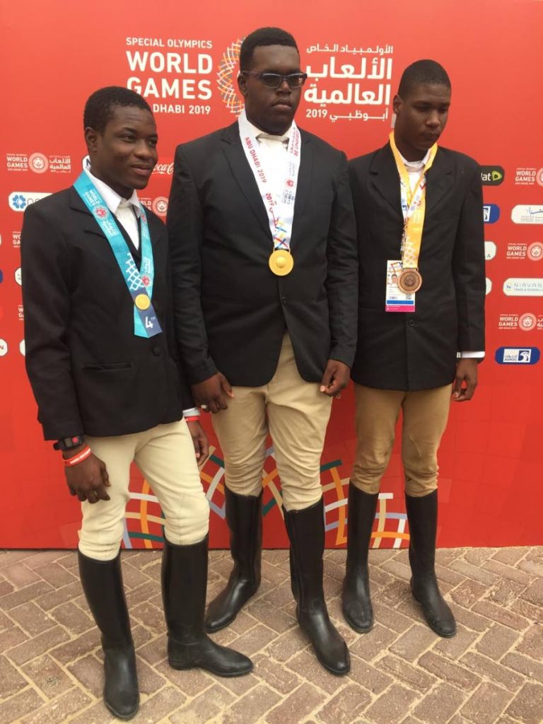 Equestrian athletes (from left) Romaldo Stafford, Aaron Ben Ali and Omari Peterson won medals yesterday for Special Olympics TT at the World Games. 