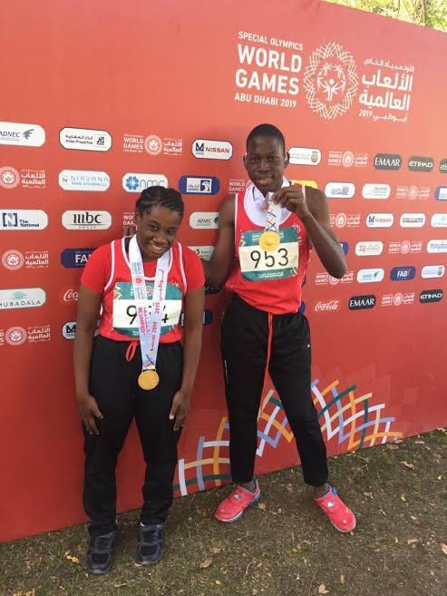 Special Olympics TT’s Sapphire Jackson, left, and Israel Duncan pose following their gold medal wins in the soft ball throw in Abu Dhabi, UAE, yesterday.
