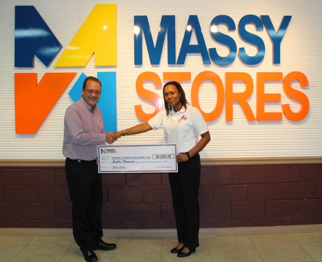 Shari Wellington-Griffith, chairman, TT Eco-Divers Club, receives a cheque for $80,000 from Thomas Pantin, executive chairman, Retail Line of Business, Massy Group in support of the group's underwater clean up exercises.
