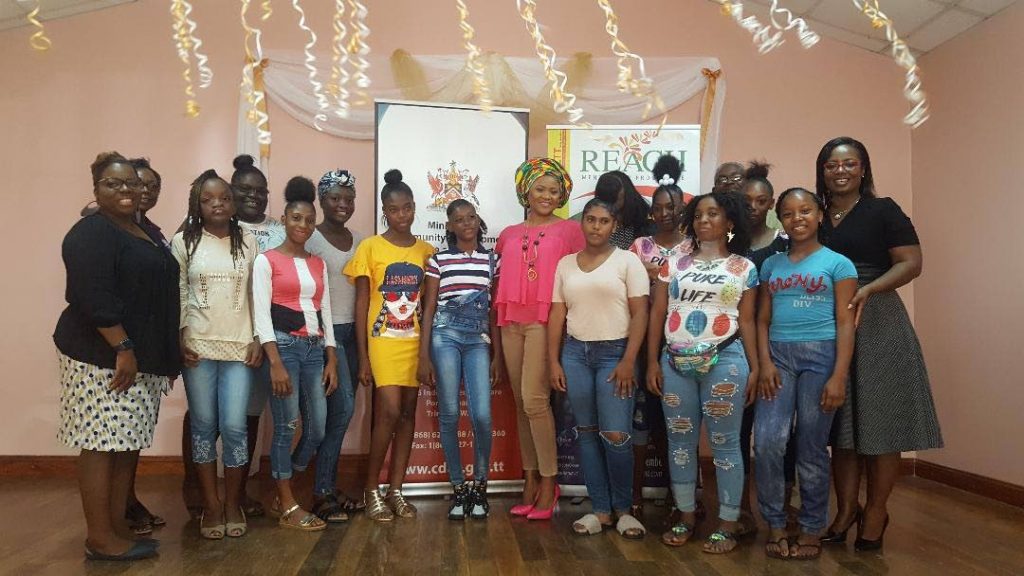 Minister of Community Development, Culture and the Arts Dr Nyan Gadsby-Dolly, centre, with some of the participants of Afett's Reach Mentorship, along with mentors Solange Richardson, left, and Afett president, Yolande Simmons, right. PHOTO BY JANELLE DE SOUZA