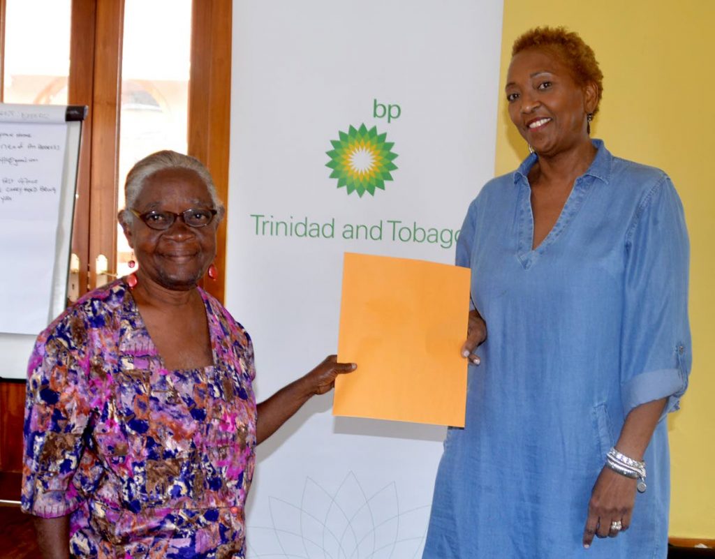  Ingrid Romain , left, receives her Certificate of Achievement from Sonja Shuffler.