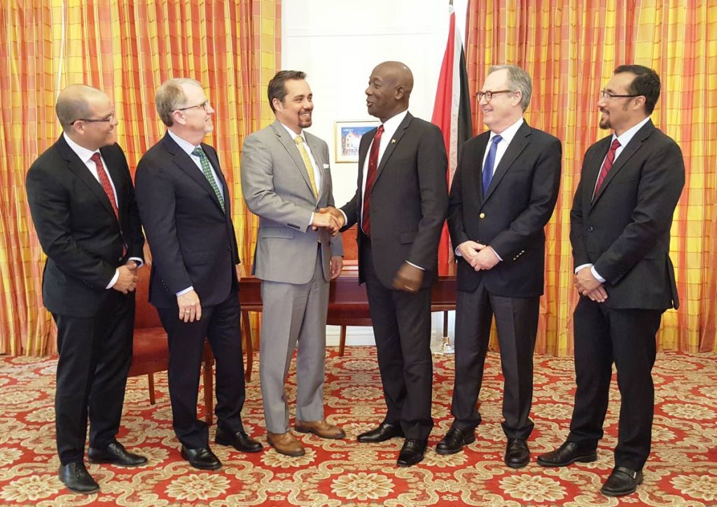 Prime Minister Dr Keith Rowley greets Ezra Yacob, EOG executive vice president, exploration and production at the Office of the Prime Minister, St Clair, Port of Spain on Tuesday. Also pictured from left is: Minister of National Security Stuart Young, William Thomas, Pat Woods, and George Vieira of EOG. PHOTO COURTESY OPM