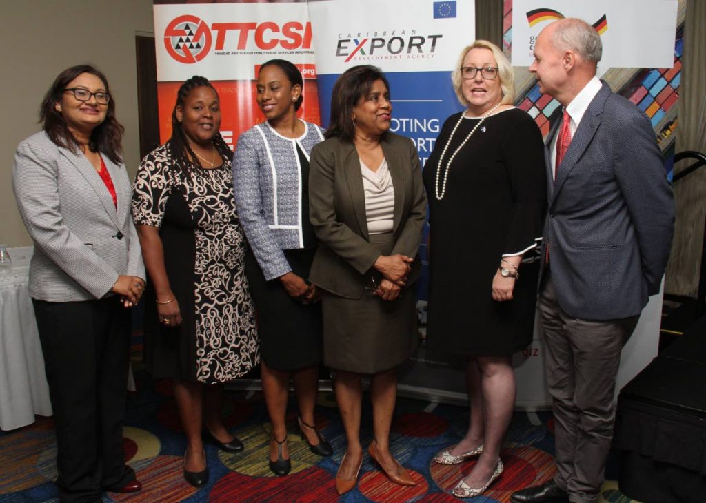 Minister of Trade and Industry Paula Gopee-Scoon, third from right, joins TTCSI general manager Vashti Guyadeen, from left, Caribbean export services specialist Allyson Francis, Deutshe Gesellschaft fur Internationale Zusammenarbeit representative Sanya Alleyne, TTCSI president Lara Quentrall-Thomas and EU delegation TT programme officer Ulrich Thiessen at the launch of a two-day workshop for cultural and creative industries, Hilton Trinidad, St Ann's on Wednesday. PHOTO BY ANGELO MARCELLE