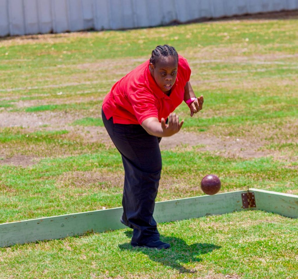 Rachel Jemmotte of the School for the Deaf and Hearing Impaired, shows her bocce skills at Tobago Special Olympics at Shaw Park yesterday.