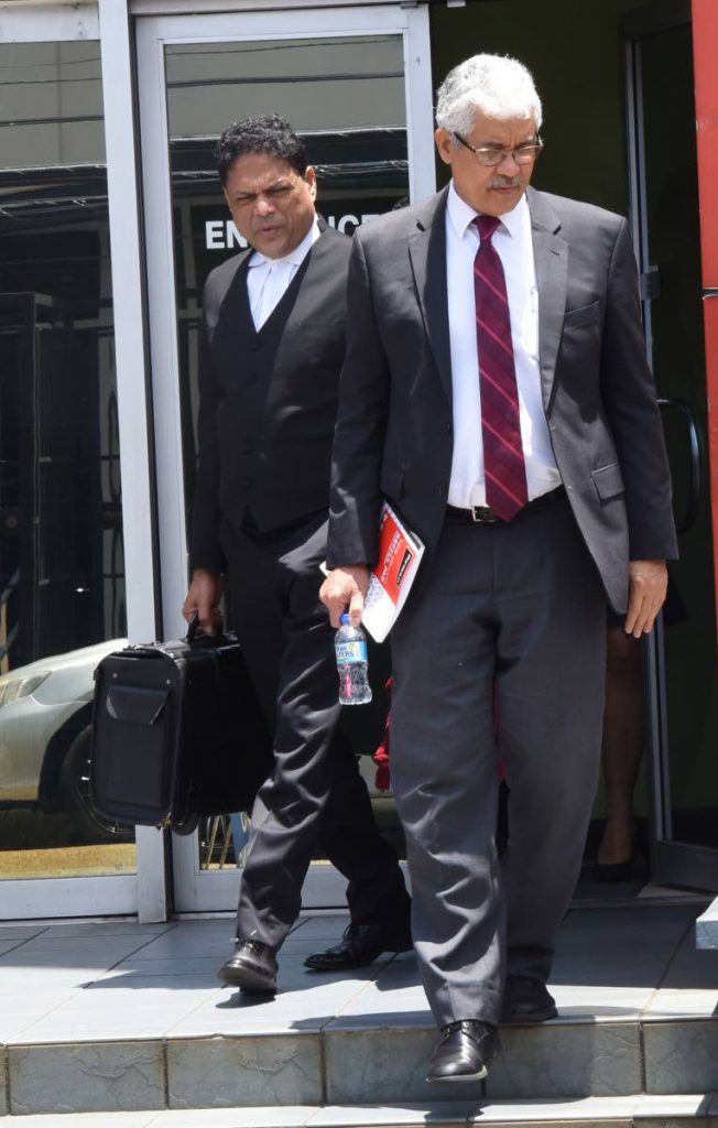 Senior Counsel Douglas Mendes, SC, right, and attorney Devesh Maharaj, both of whom  represent Guyana's People's Progressive Party and its leader Bharrat Jagdeo, leave the Caribbean Court of Justice in Port of Spain after a hearing of separate appeals on Guyana's no-confidence vote yesterday. PHOTO BY KERWIN PIERRE