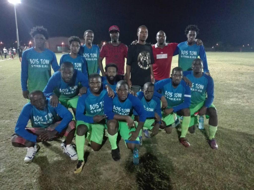  Boys Town celebrate their victory, on Friday, in the opening match of the annual Sweet Sixteen Football League at the Ojoe Road Recreation Ground, Sangre Grande. PHOTO BY STEPHON NICHOLAS