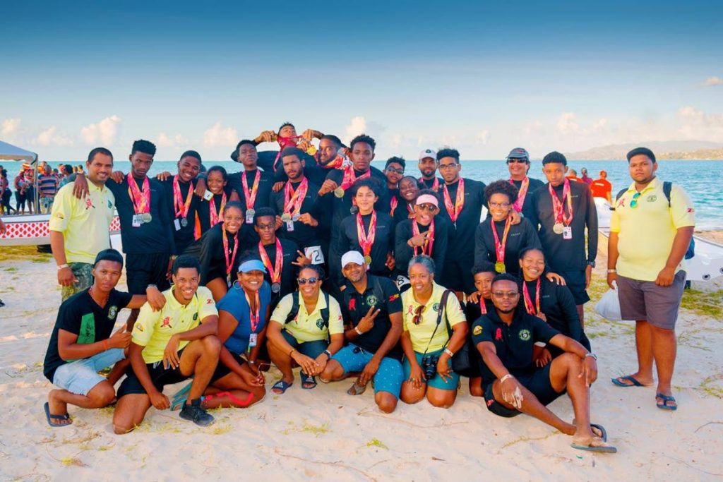 In this file photo,members of the One Ton Warriors Trinity College team,celebrate winning the mixed Under-21 category, at the recent Pan American Club Crew Championships, at the Pigeon Point Heritage Point, Tobago.