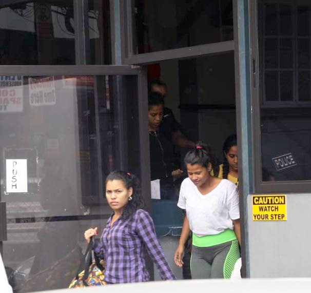  Thirty-two Venezuelans including these women appeared in the Siparia Magistrates Court yesterday charged with illegally entering Trinidad over the weekend. 