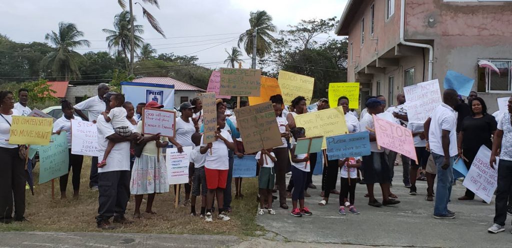 Crown Point/Bon Accord residents protesting last month, calling for more information on the land acquisition process for the building of a new terminal at the ANR Robinson International Airport. FILE PHOTO
