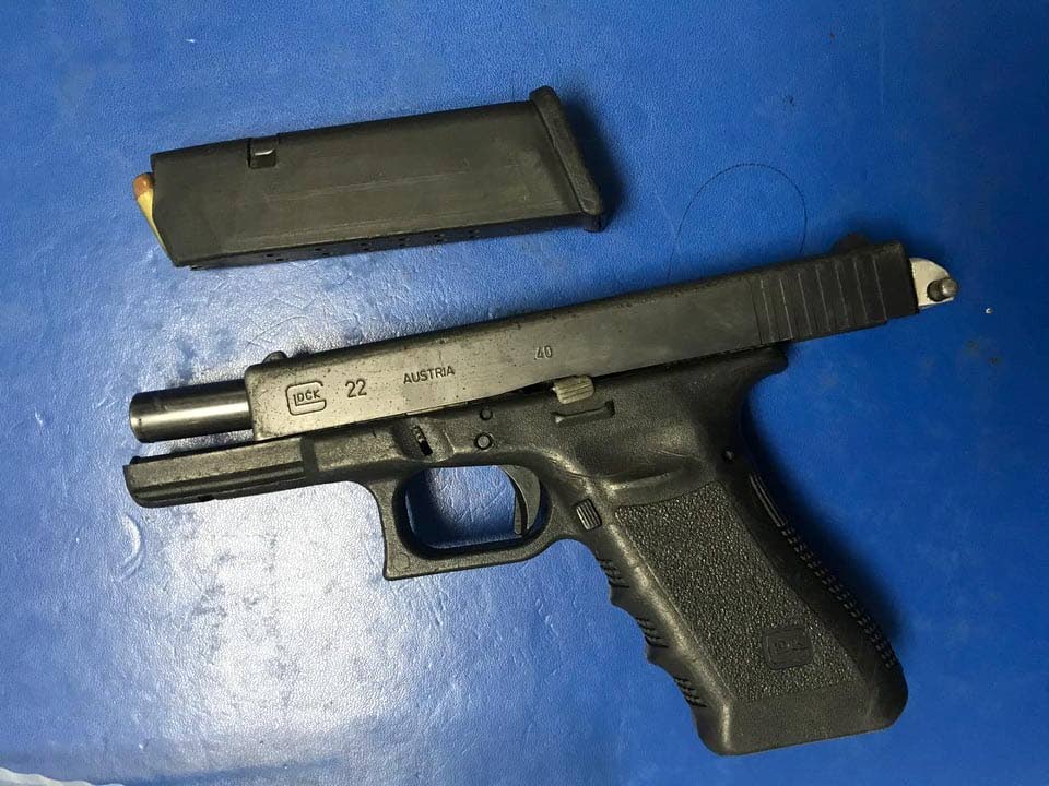 A Glock 22 pistol with a magazine containing 10 rounds of .40 caliber ammunition were seized during a police exercise along George Street last night.  PHOTO COURTESY TTPS