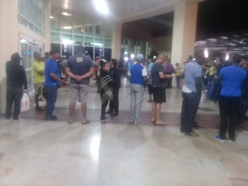 Customers at Piarco Airport wait to pay for parking tickets last evening. There were operational issues reported with the system, causing a lengthy back-up, which the Airports Authority of TT said was as a result of teething problems with the newly-implemented system. 