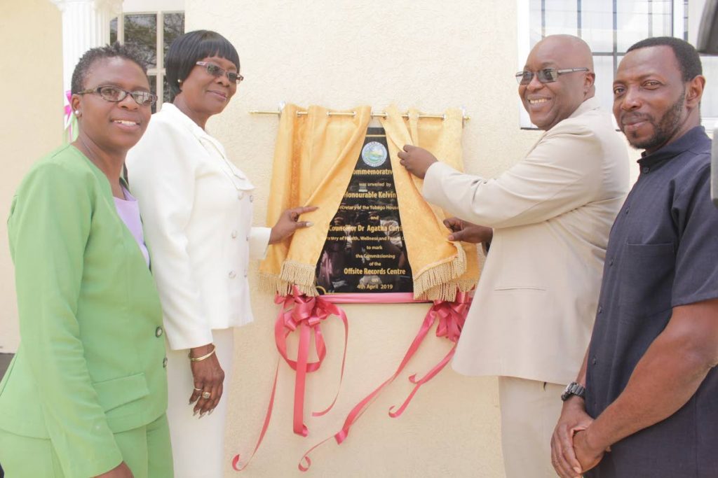 DATA CENTRE: Dianne Baker-Henry, left, administrator in the Division of Health, Wellness and Family Development; Health Secretary Dr Agatha Carrington, second from left; Chief Secretary Kelvin Charles, second from right, and Pastor Ellis Clarke, right, at the commissioning of an Off-Site Records Centre at Salandy Building, Piggott Street, Uptown Scarborough, recently. 