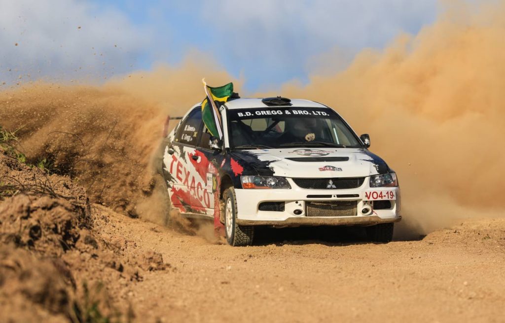 Jamaican duo, Kyle Gregg and Marcia Dawes compete with their Evolution IX, on Sunday, at this yesr's Rally Trinidad, in Couva.