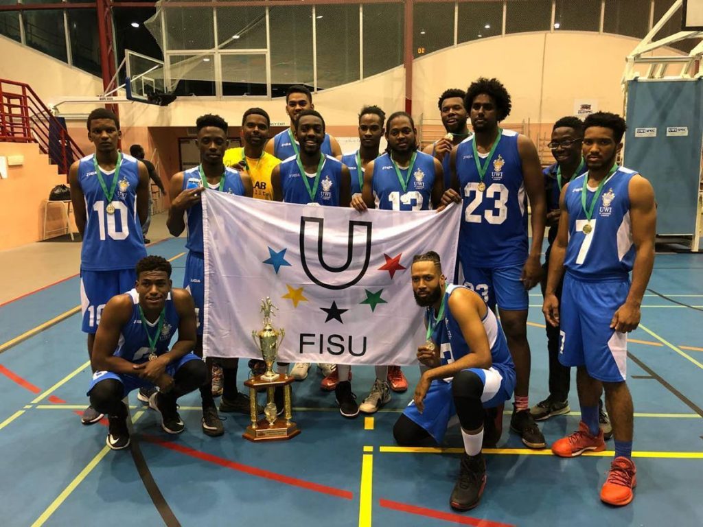 The University of the West Indies men's basketball tem celebrates winning the Tertiary Schools Association of TT (TSATT) Basketball competition  after beating MIC 56-39, on Tuesday night, at UWI SPEC, St. Augustine. 