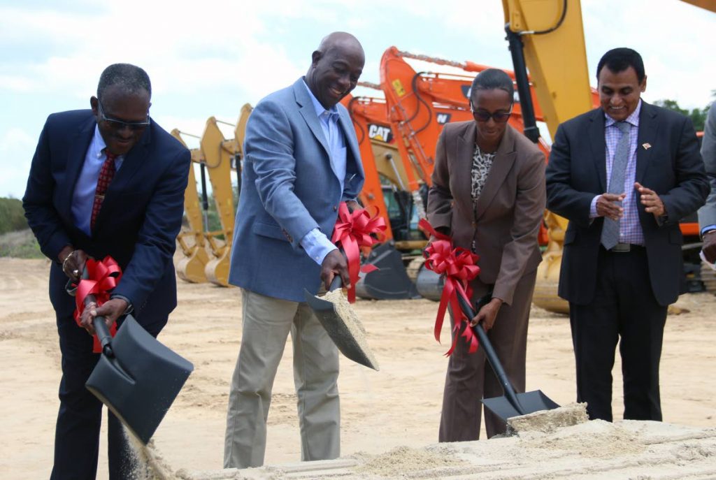 Prime Minister Dr Keith Rowley, second from left, is seen turning the sod for the Point Fortin area of the San Fernando to Point Fortin Highway yesterday along with with, from left, MP for Point Fortin Edmund Dillion, MP for La Brea Nicole Olivierre, and Minister of Works and Transport Rohan Sinanan yesterday