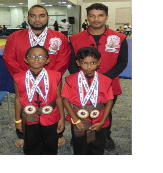 The Grand Master Ted Sandy Nature Fist Kung Fu Academy team include Fawwaz Khan (back left), Master Reyaz Mohammed (back right), Jaden Inniss (front left) and Joshua Soogrim.