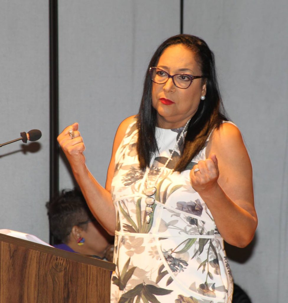 Lynette Seebaran-Suite. chairman of the Equal Opportunity Commission of T&T, speaks at a domestic violence symposium,  hosted by the Faculty of Social Sciences, UWI, St Augustine, yesterday.